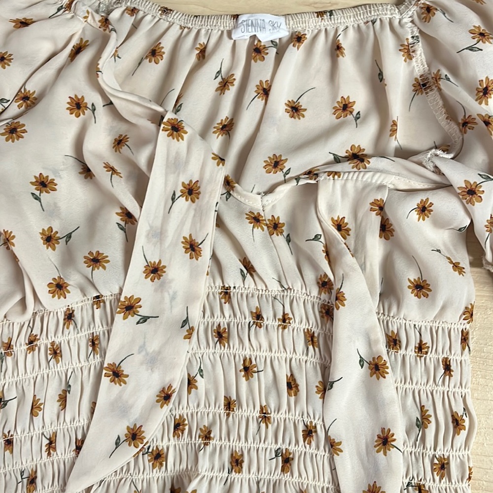 I’m selling a top from the brand Sienna Sky.